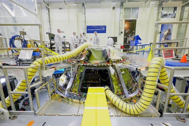 Technicians work on the Artemis III Orion crew module inside the Operations and Checkout Building at NASA&rsquo;s Kennedy Space Center in Florida on March 5, 2025.